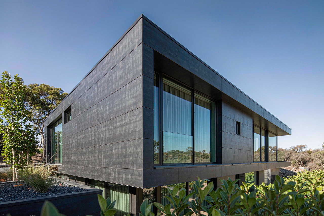 Contemporary home with charcoal HPL panels